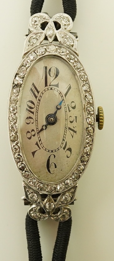 A lady's 1920's/1930's platinum and diamond cluster set cocktail watch